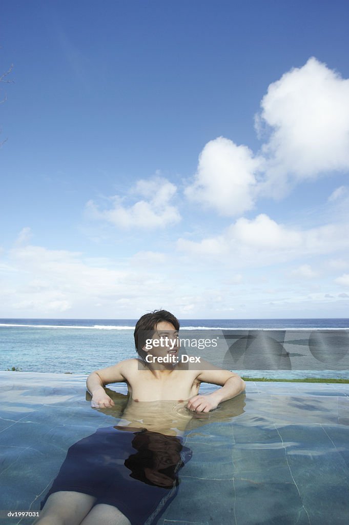 Man Lying in a Swimming Pool