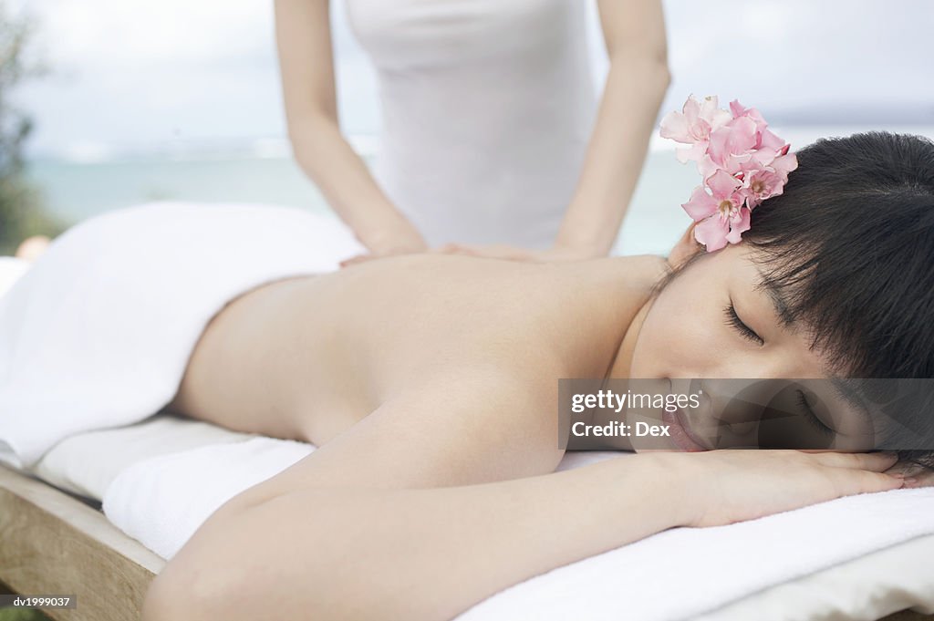 Woman Has Her Back Massaged