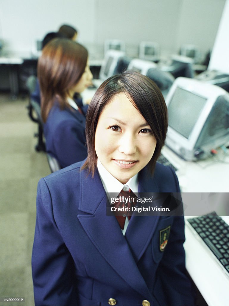 Female High School Student Sitting in a Computer Classroom