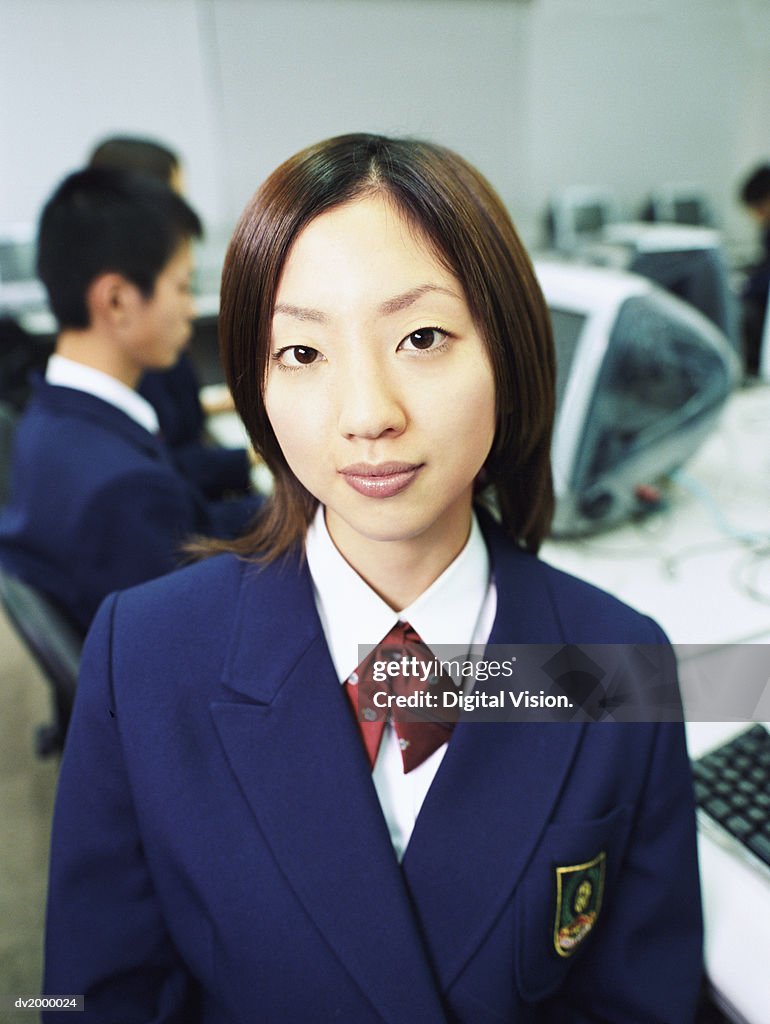 Portrait of a Female High School Student in a Computer Classroom