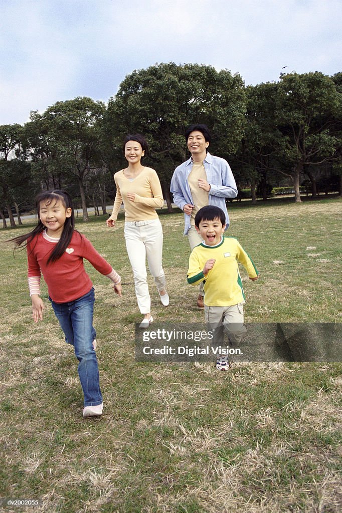 Family Running in a Park