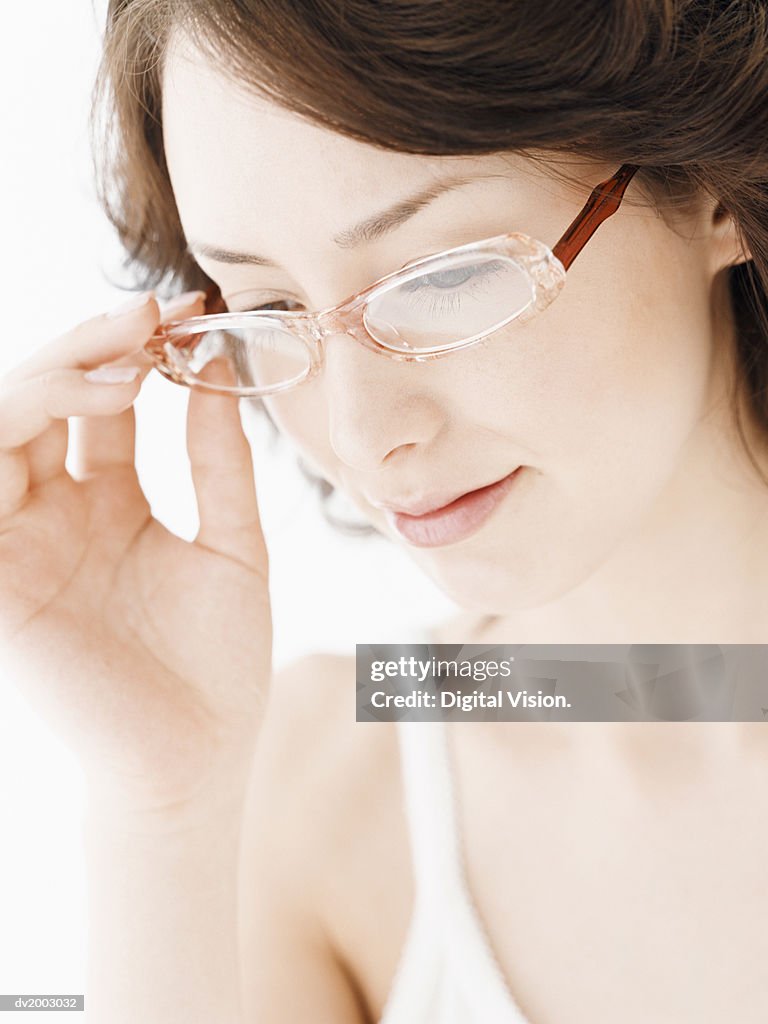 Woman Wearing Glasses Looking Down