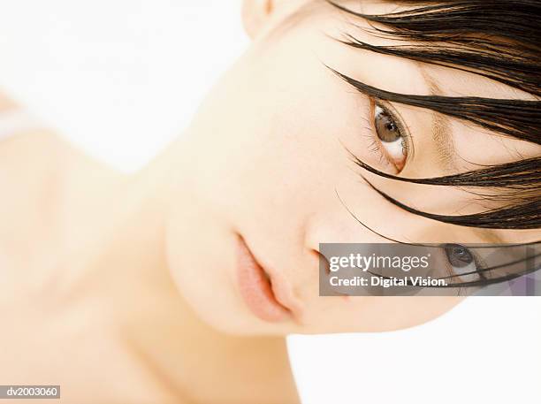 studio portrait of a woman with spiky brown hair - wonky fringe stock pictures, royalty-free photos & images