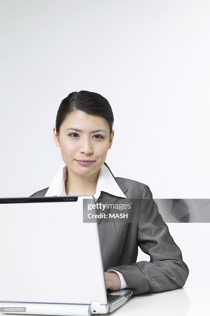 Portrait of a Businesswoman Sitting With a Laptop