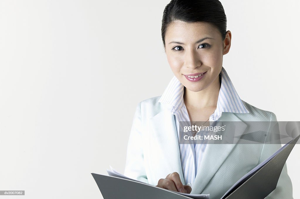 Portrait of a Businesswoman With a Folder in Her Hands