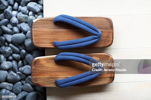 elevated view of a pair of geta sandals - geta sandal stock-fotos und bilder