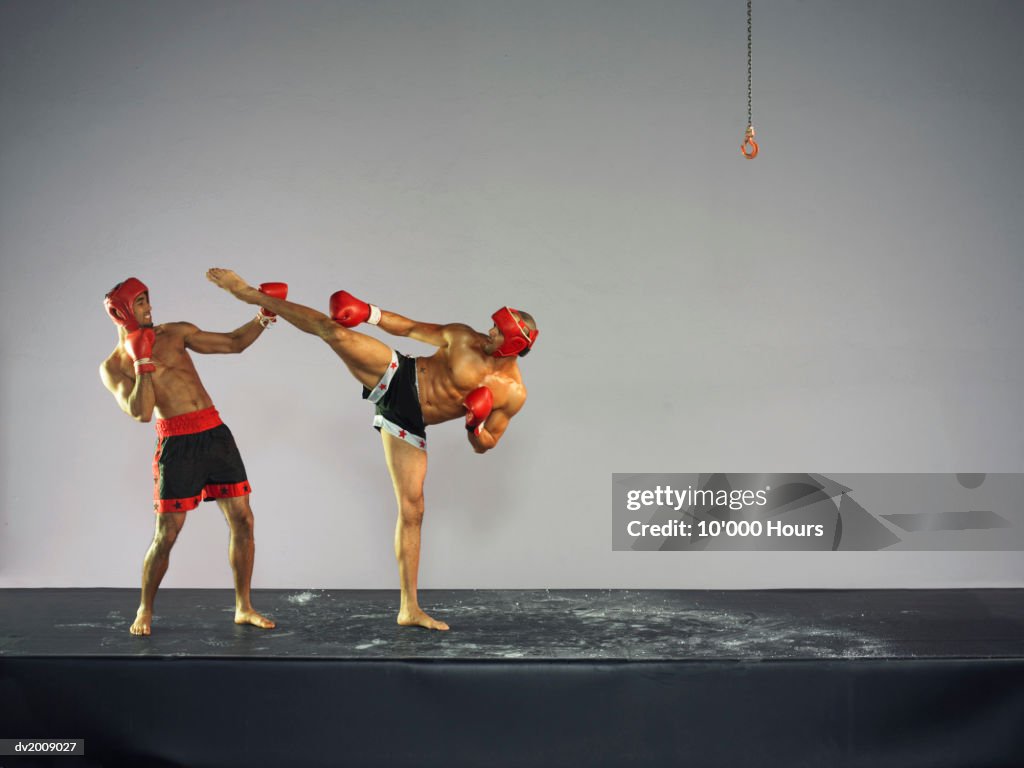 Two Male Kick Boxers in a Fight