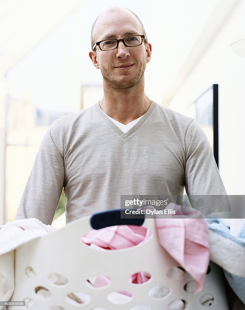 Man Carrying a Laundry Basket