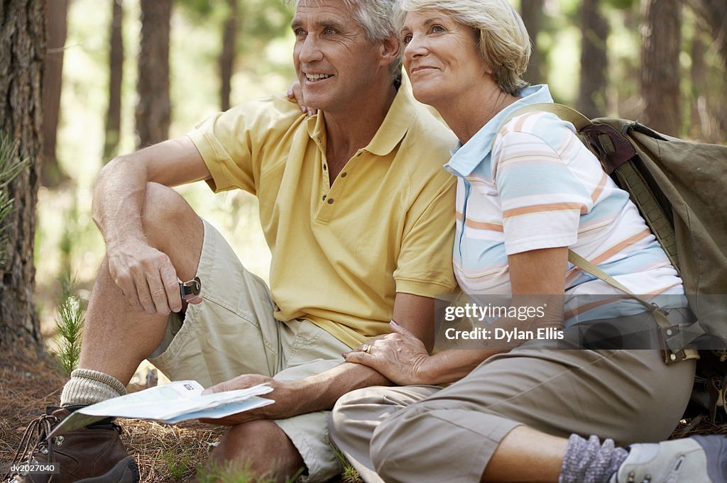 Senior Couple Sitting in a Forest