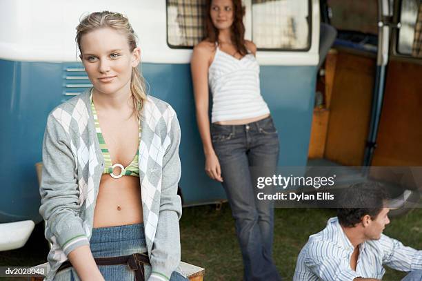 young woman sitting in front of a caravan - ellis stock-fotos und bilder