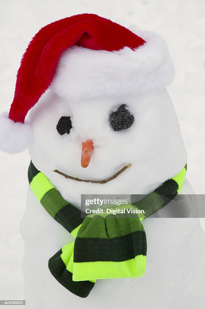 Snowman Wearing a Santa Hat