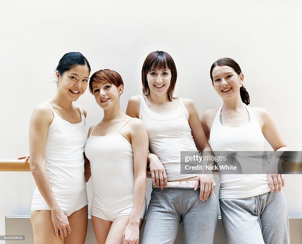 Portrait of Four Female Dancers Standing in a Line