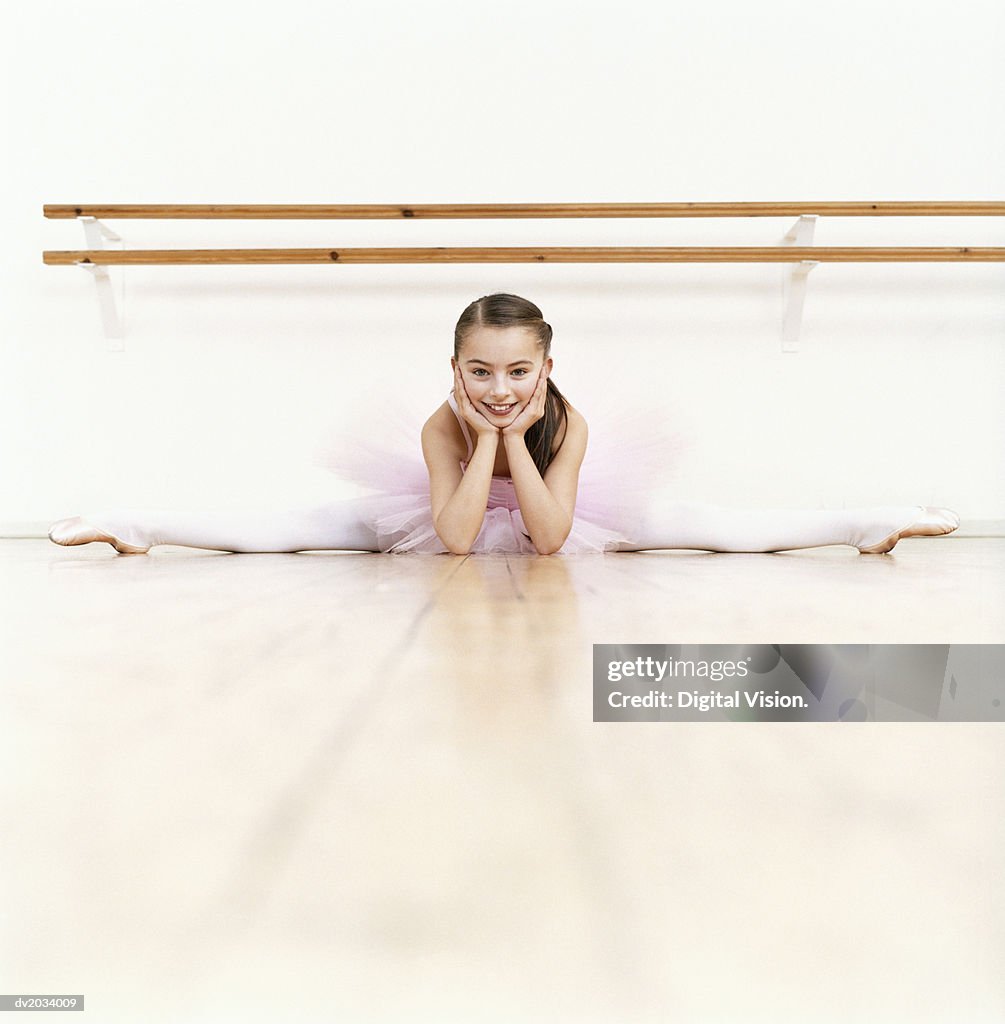 Young Ballet Dancer Doing the Splits in a Dance Studio