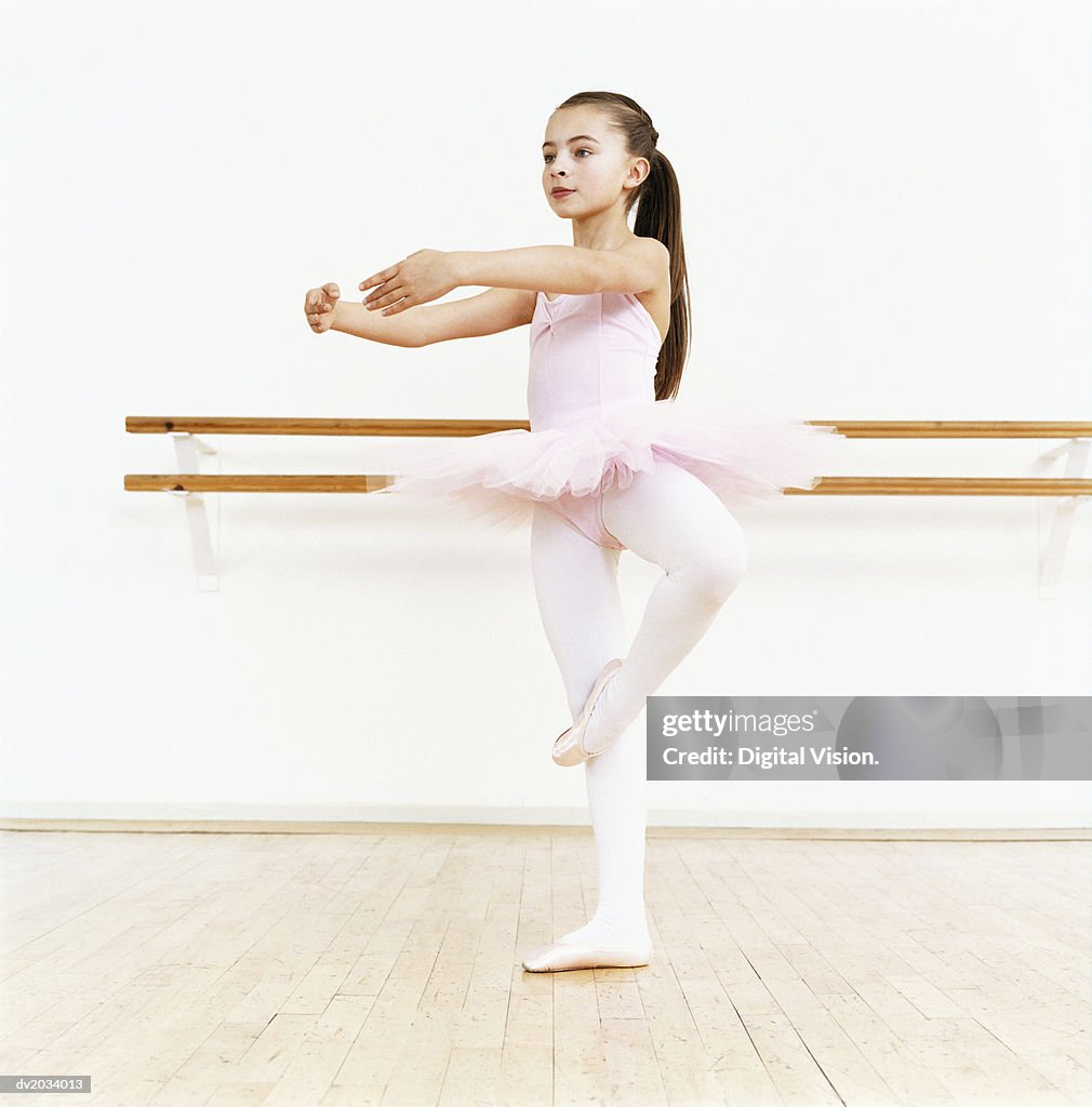 Young Ballet Dancer Practicing in a Dance Studio