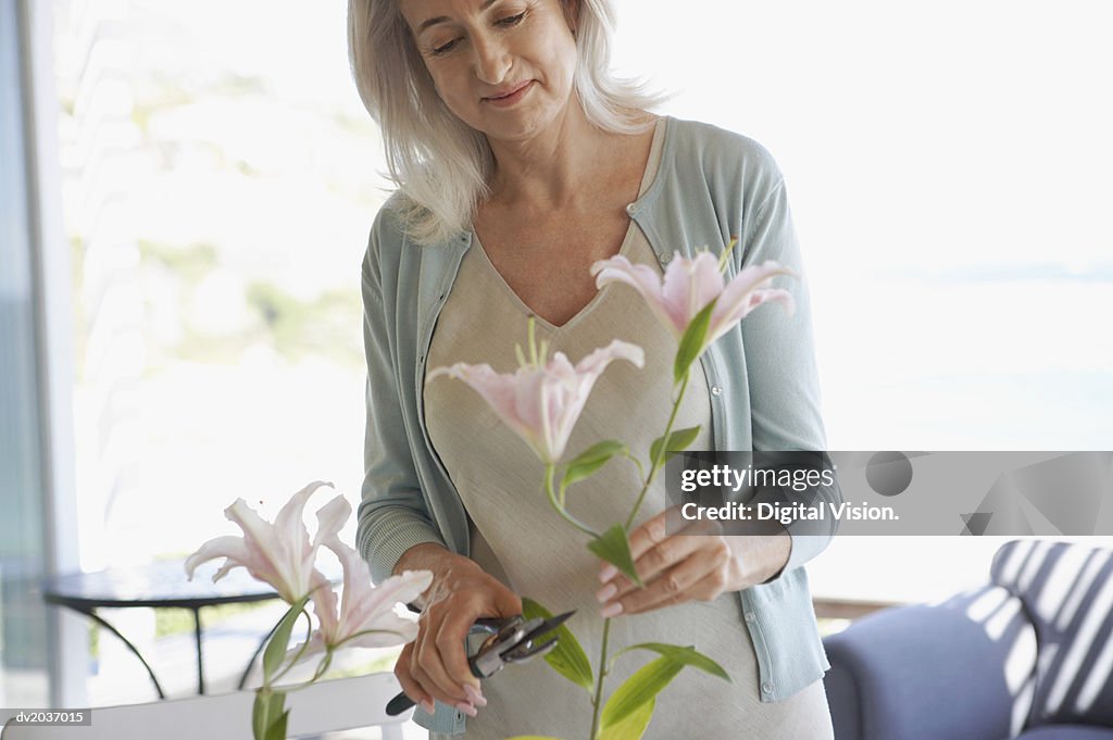 Senior Woman Pruning Cut Flowers