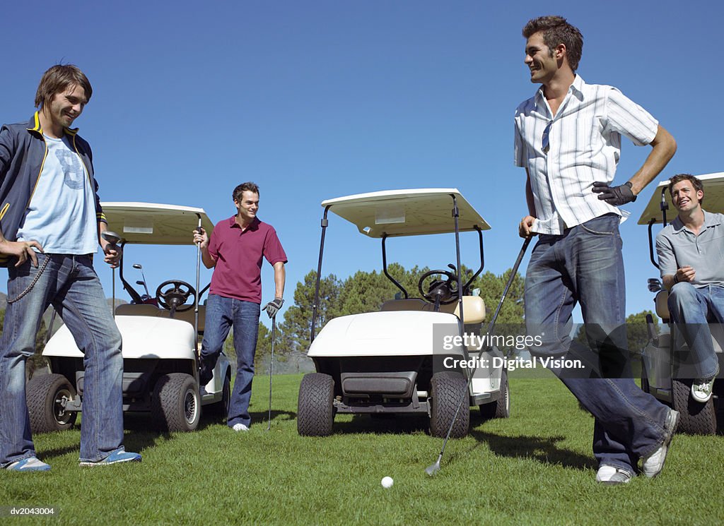 Four Friends Standing Together on a Golf Course