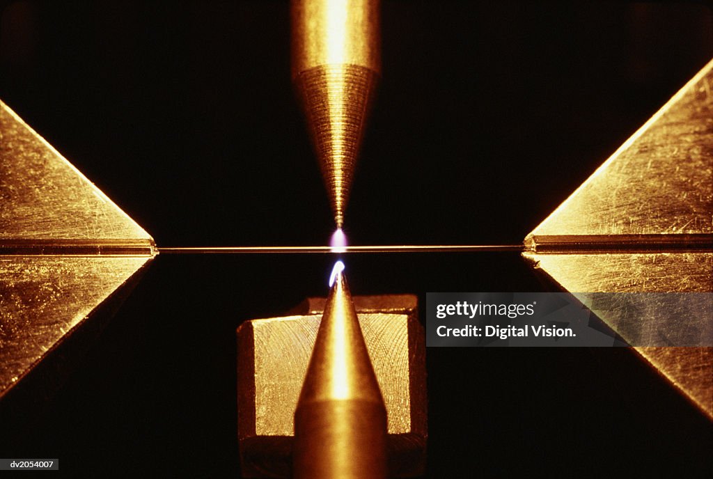 Close Up of a Laser Tool Cutting a Metal Plate