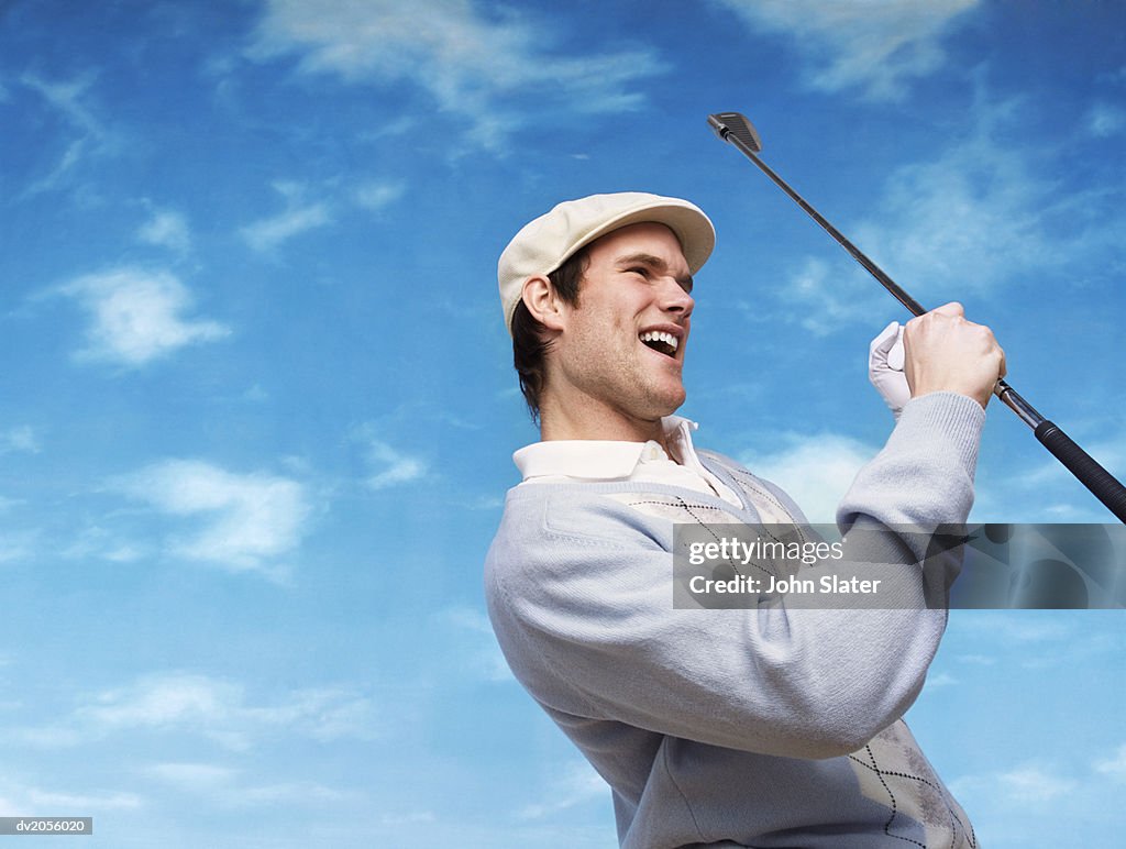 Golfer Holding a Golf Club and Cheering