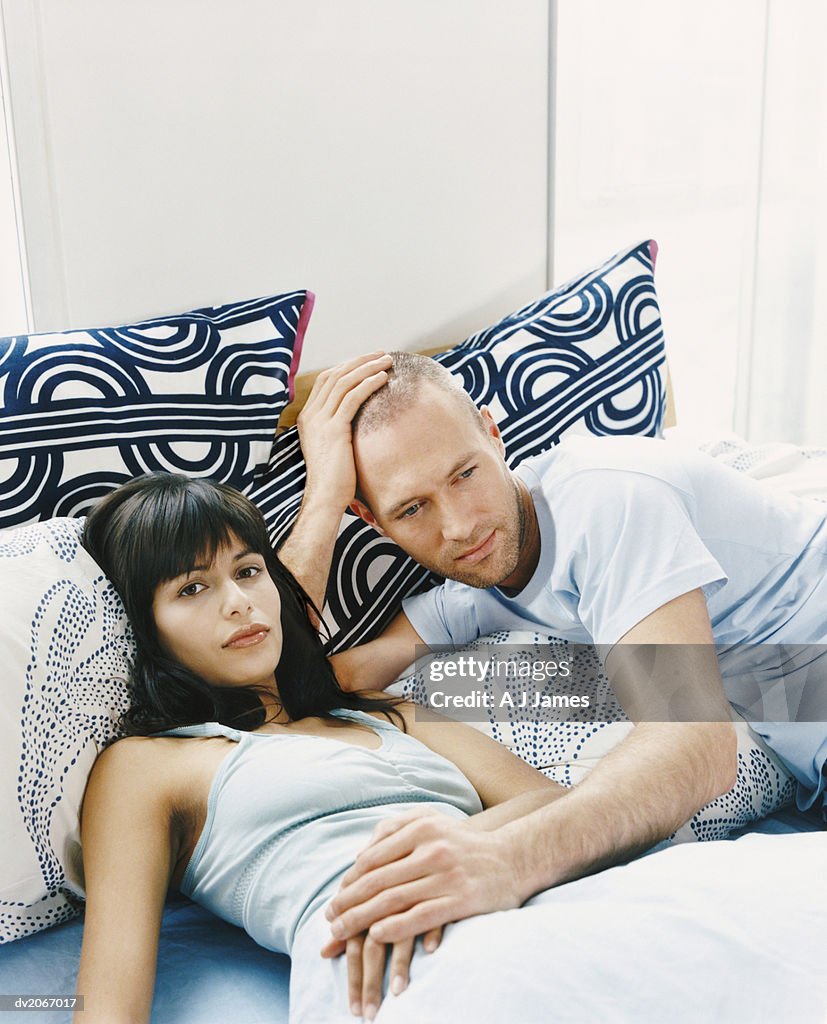 Couple Lying Together in Bed