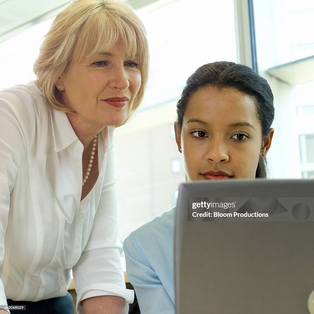 Two Businesswoman Looking at a Laptop