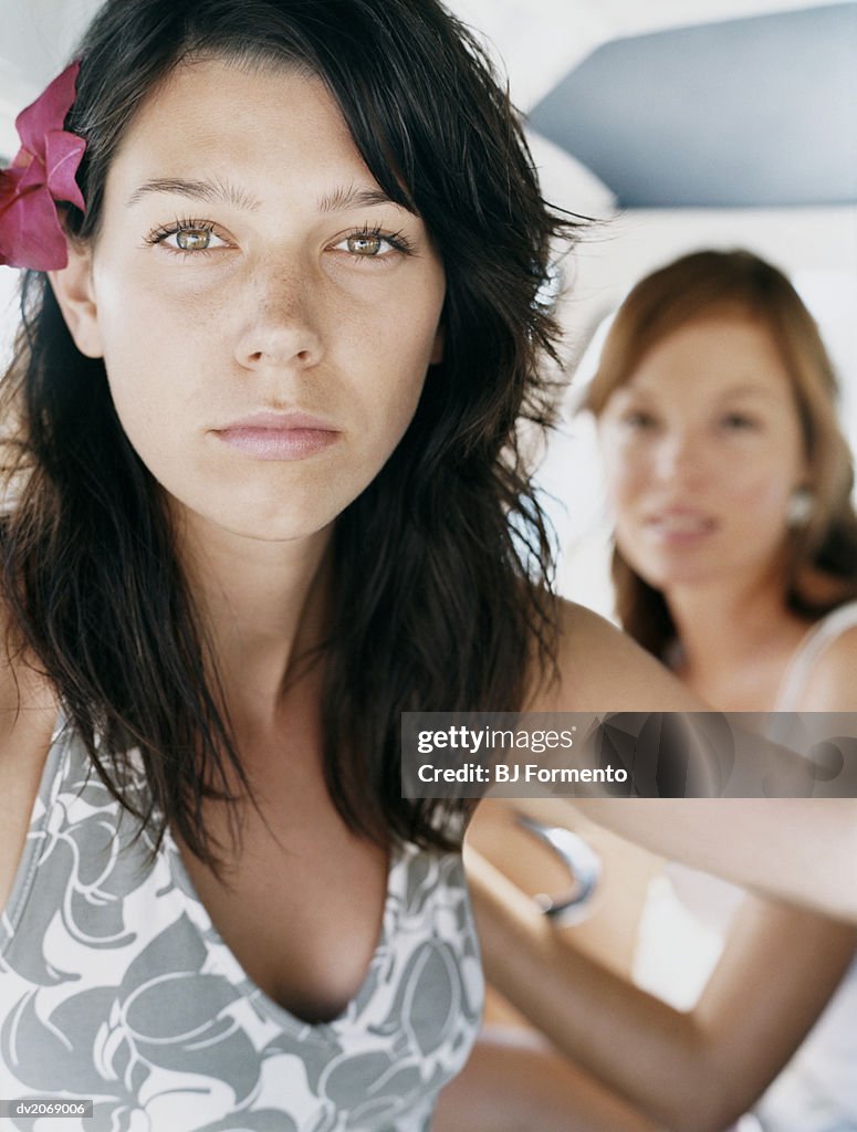 Serious Looking Woman With a Flower in Her Hair