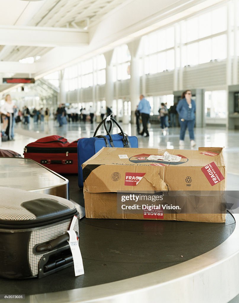 Damaged Package on a Airport Baggage Conveyor Belt