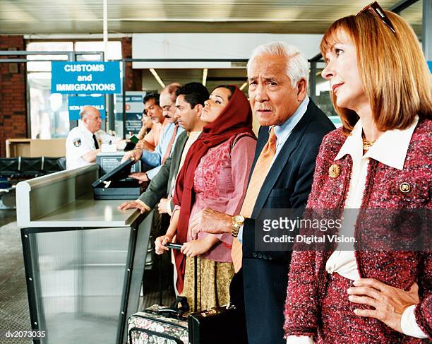 people queuing at airport security - the old guard stock pictures, royalty-free photos & images