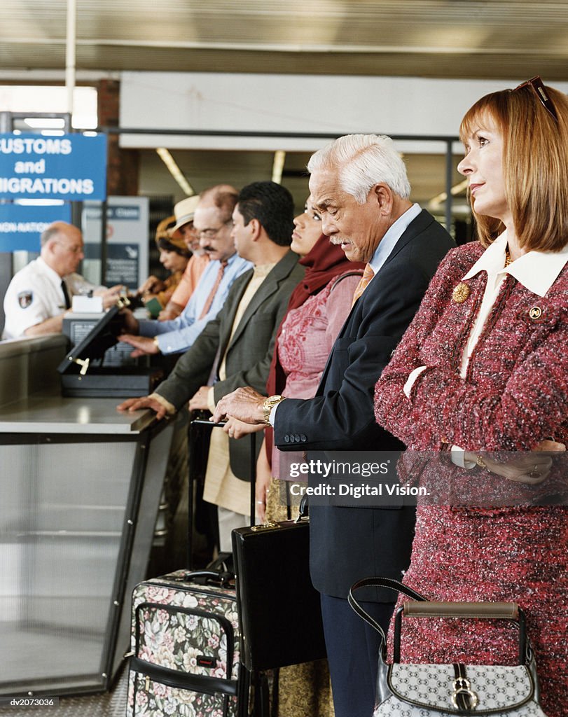 People Queuing at Airport Security