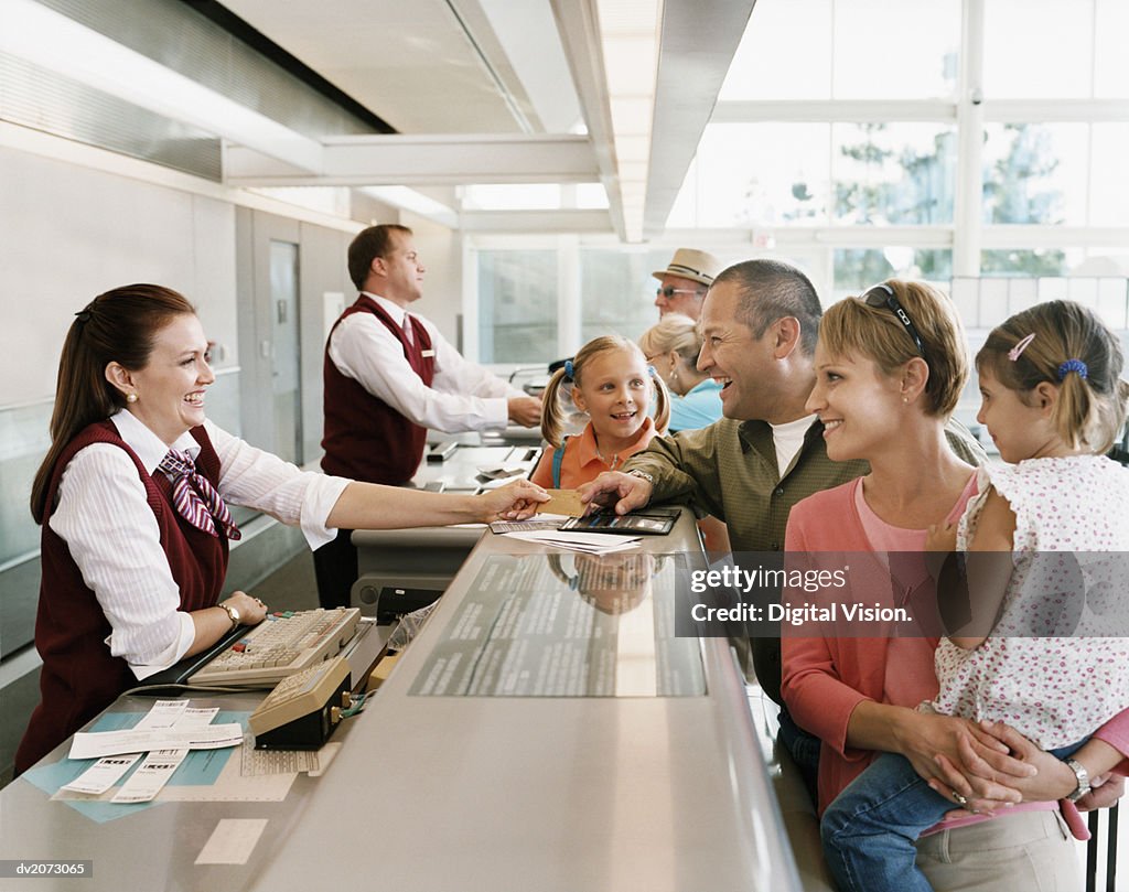 Passengers at Airport Check-in Desk