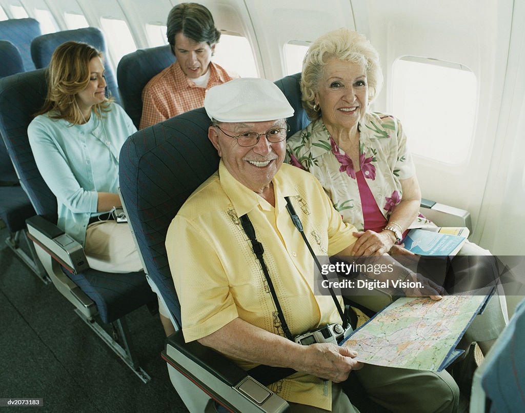 Senior Couple Sitting on a Plane