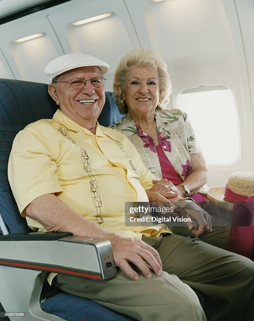 Portrait of a Senior Couple Sitting Together on a Plane