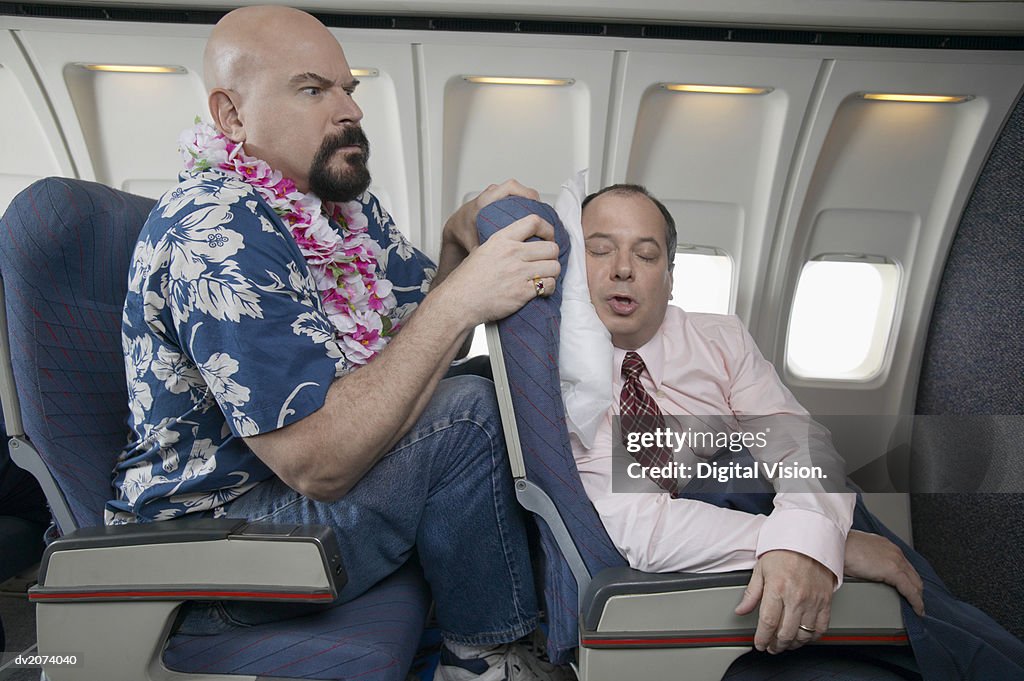 Passenger Angry About the Lack of Seating Space on a Aeroplane