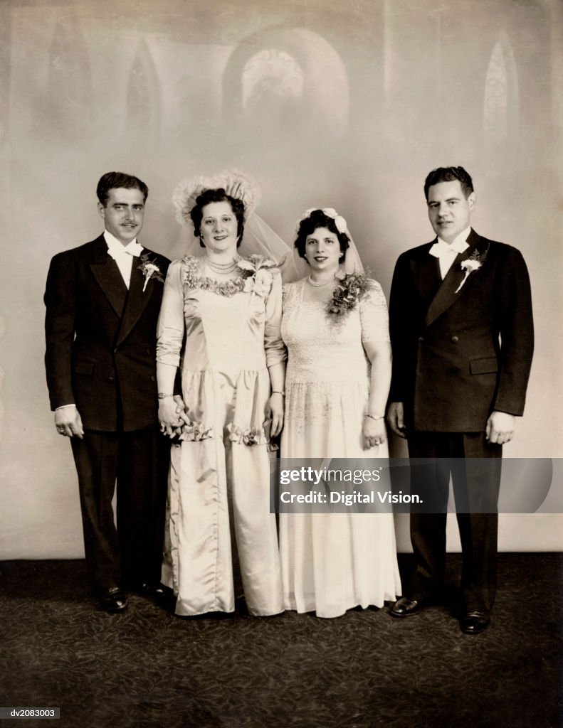 Portrait of Two Brides and Two Grooms