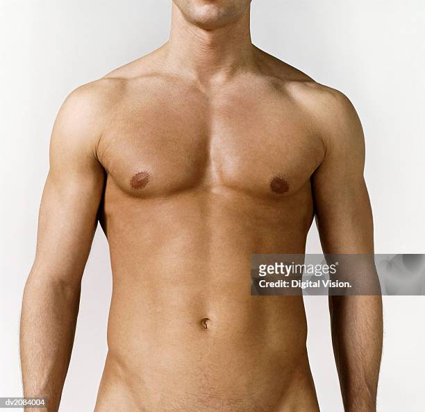 mid section view of a naked man's stomach - torso stock pictures, royalty-free photos & images