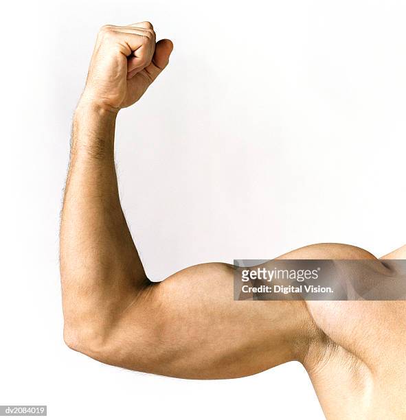 naked man showing his biceps - muscular build stock pictures, royalty-free photos & images