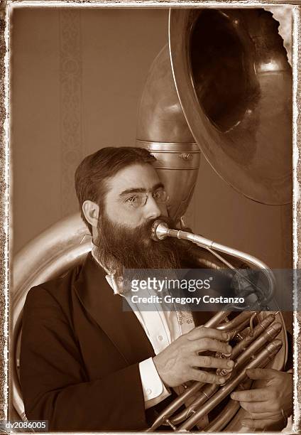 old fashioned portrait of a male tuba player - greggory stock-fotos und bilder