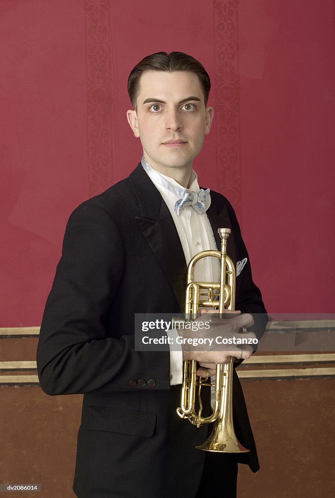 Portrait of a Male Trumpet Player in a Suit