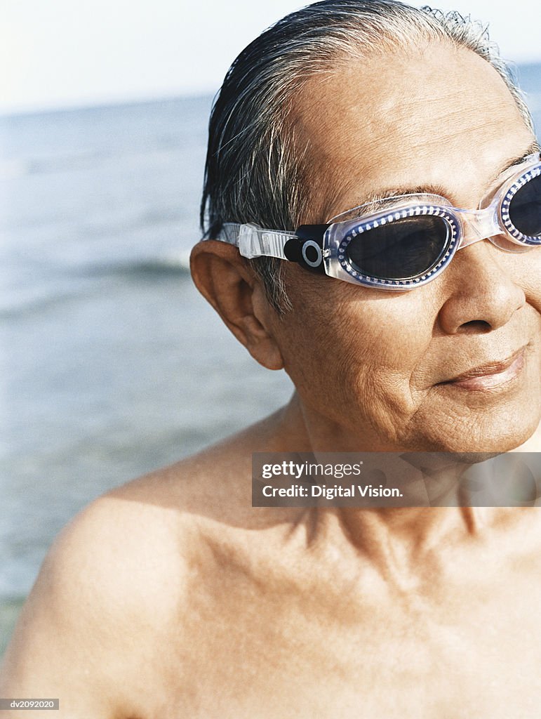 Senior Man in a Swimming Pool, Wearing Swimming Goggles