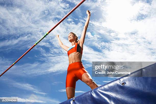 athlete celebrating after doing the high jump - women's field event foto e immagini stock