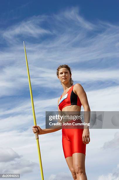 woman with a javelin - womens field event stock pictures, royalty-free photos & images