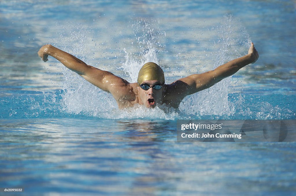 Man Swimming in a Swimming Pool