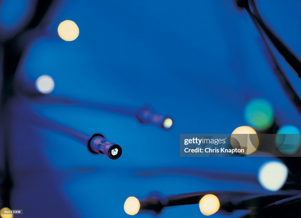 Fiber-optic points of light on a blue gradient backdrop