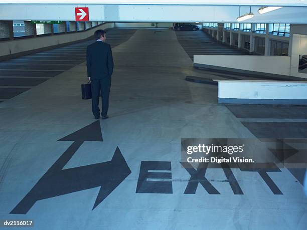 businessman in a car park - escrita ocidental imagens e fotografias de stock