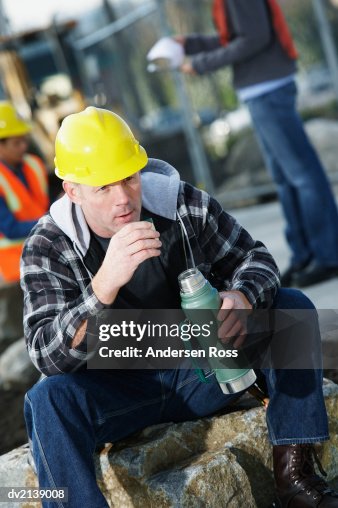 Builder Drinking From a Drinks Flask Builder Drinking From a Drinks Flask