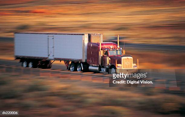 speeding truck with blurred scenery - panorering bildbanksfoton och bilder