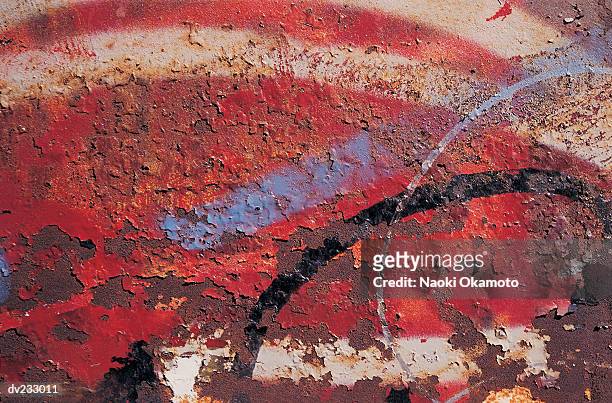 collage of varying red shades peeling off painted cement - peeling off bildbanksfoton och bilder