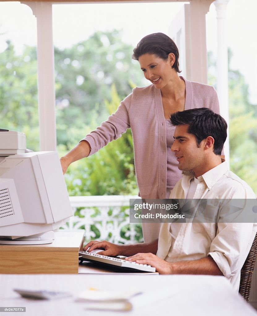 Couple working on computer