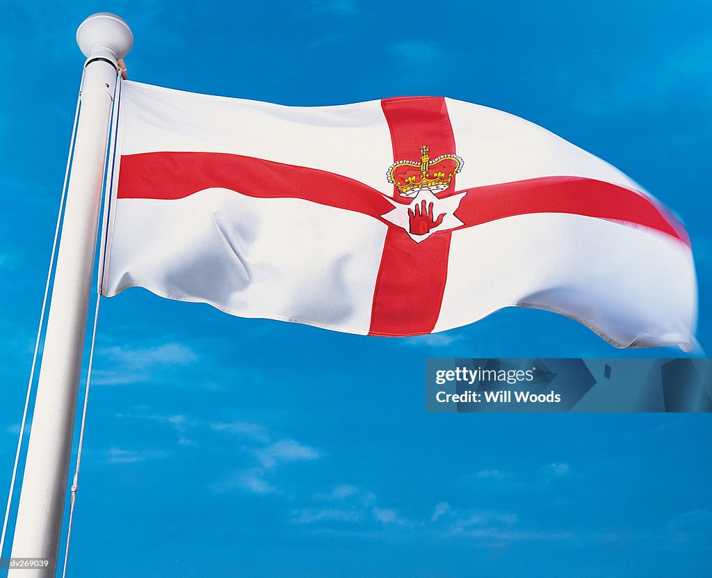 Flag of Northern Ireland waving in the wind on flagpole