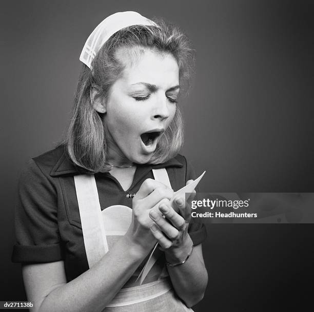 yawning waitress taking order - overworked waitress stock pictures, royalty-free photos & images