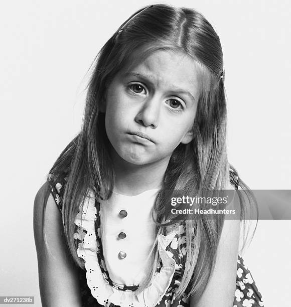 unhappy girl frowning - headhunters stock-fotos und bilder